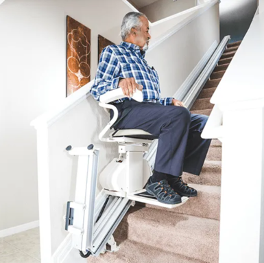 Stair lift with folding rail